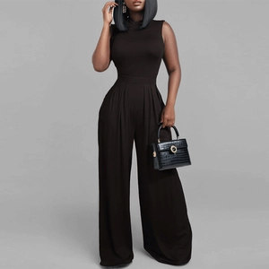 Detail of high-waist black sleeveless wide-leg jumpsuit with elegant draping fabric
