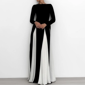 Detailed view of the contrast color stitching on the elegant black and white maxi dress