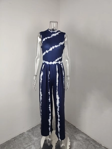 Elegant slim fit sleeveless jumpsuit featuring white tie-dye diagonal print on dark blue.