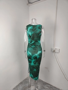 Detail showing the green floral abstract print and ruched waist of this sleeveless dress