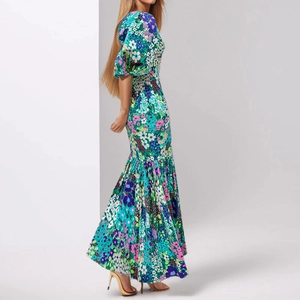 Close-up of floral print maxi dress featuring puff sleeves and a slim fit silhouette