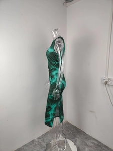 Detail of green and black tie-dye print dress with side slit and waist pleats