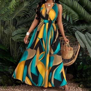 Close-up of tropical abstract print maxi dress with deep V-neck and cinched waist
