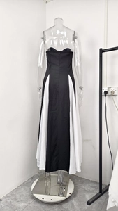 Detailed view of the invisible back zipper and waist tailoring on the A-line dress
