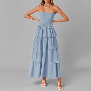Detail of light blue strapless dress featuring a tiered skirt and smocked bodice