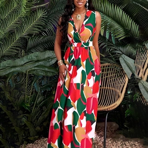 Detail of elegant V-neck sleeveless maxi dress with colorful abstract tropical prints