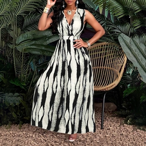 Detailed view of elegant V-neck sleeveless dress with black and white abstract stripe pattern