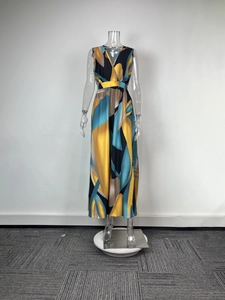 Detail of elegant V-neck sleeveless dress featuring bold geometric abstract art print