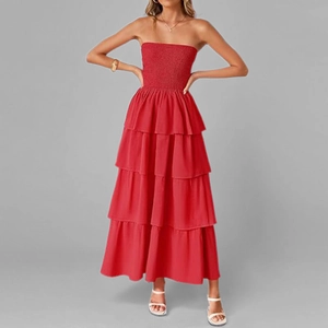 Detail of red strapless tiered dress featuring a shirred bodice and ruffled skirt layers