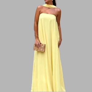 Detail of elegant strapless pale yellow maxi dress with matching fabric neckband accessory