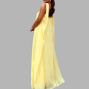 Elegant pale yellow sleeveless backless long evening dress with flowing fabric
