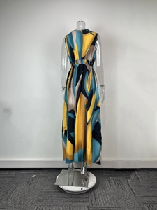 Detail of elegant V-neck sleeveless maxi dress featuring bold abstract geometric patterns