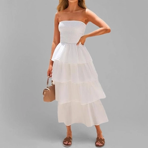 Detailed view of white strapless tiered maxi dress with ruched elastic bodice and layered hem