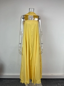 Detail view of a bright yellow sleeveless A-line maxi dress with elegant strapless design
