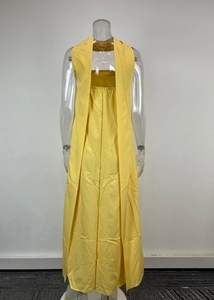 Back view of elegant bright yellow strapless maxi dress with double layered skirt detail