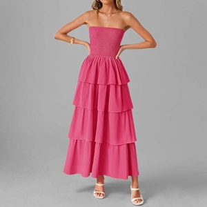 Detail view of hot pink smocked tube top and tiered cake dress for summer vacations