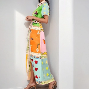 Detail of vintage patchwork print maxi dress with shirt collar and waist tie belt