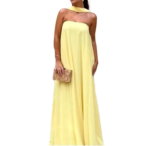 Elegant pale yellow sleeveless halter maxi dress with a chic strapless neckline design