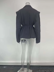 Rear view of elegant dark grey blazer with shoulder pads and tie-waist detail