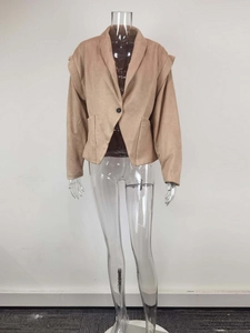 Detail view of the camel shawl collar jacket showing soft fabric and shoulder folding structure