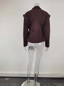 Detail view of the structured shoulders and back seams of this brown faux suede blazer