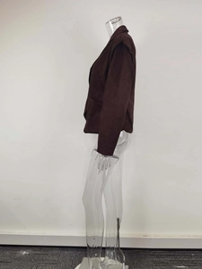 Detailed side view of dark brown buttoned jacket showing shoulder pads and slim fit design