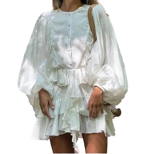 Elegant white ruffle mini dress with lantern sleeves and textured fabric on white background