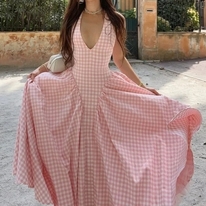 Pink and white checkered halter neck maxi dress with a deep V-neck and open back