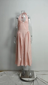 Detail of pink and white gingham halter dress showing deep V-neck and plaid texture