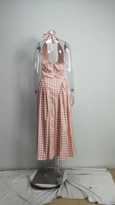 Detail of pink gingham halter dress featuring an open back and pleated waist detail