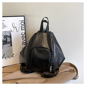 Detailed side view of black geometric PU leather backpack with adjustable straps