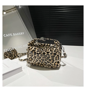 Close-up of leopard print tote bag with glossy finish and detachable shoulder strap