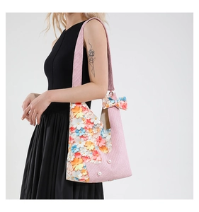 Pink tulip shoulder bag with 3D floral petals and white pearls on woven fabric