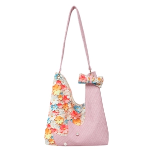 Pink floral tote bag with 3D 3D flowers and pearl accents in a stylish 2025 design