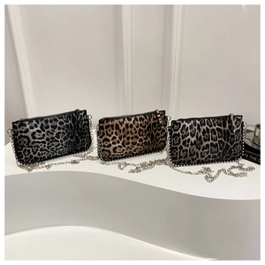 Chic leopard print crossbody bags with silver chain straps in three stylish color tones