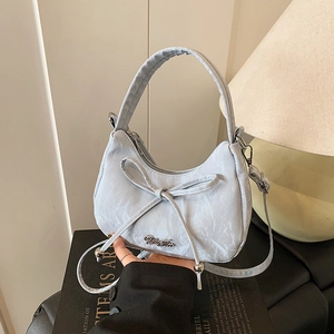 Light blue bow-knot crossbody bag with marble texture and silver logo nameplate