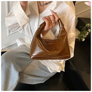 Chic chocolate brown glossy shoulder bag with gold 'FASHION & BAGS' lettering on the side