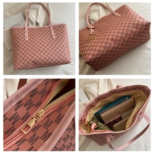 Pink tote bag with M-letter monogram print, gold logo pendant and spacious interior
