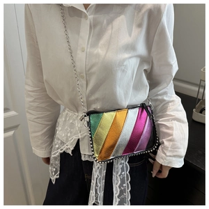 Detailed shot of rainbow striped crossbody bag with silver rivets and metal chain strap