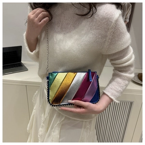 Detail of colorful rainbow metallic crossbody bag with silver studs and chain strap