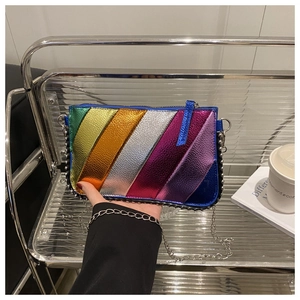 Close-up of metallic rainbow crossbody bag with chain strap and beaded edge decoration