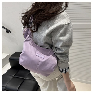 Lavender crescent nylon tote bag with wide strap and detachable round coin purse detail