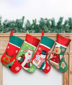 Detail of four embroidered Christmas stockings with reindeer and Santa hanging on a mantel