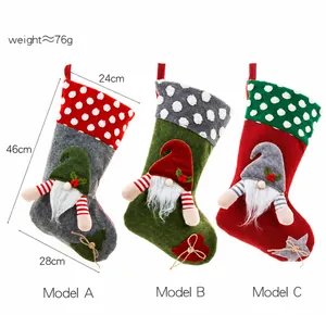 Three-piece Christmas gnome stockings set in grey, green, and red with 3D gnome doll details