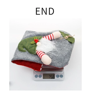 Detailed view of grey gnome Christmas stocking gift bag weighing 75.8g on a digital scale