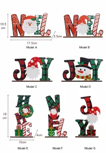 Wooden Christmas table signs showing NOEL and JOY with gnomes and snowman details