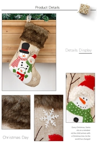 Detail of burlap Christmas stockings with snowman embroidery and faux fur trim