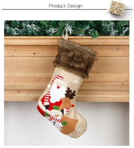 Close-up of burlap Christmas stockings with 3D Santa, reindeer, and snowman patches