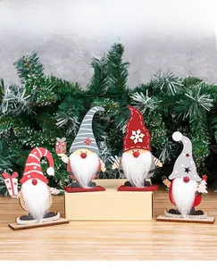 Set of four wooden Christmas gnomes with long beards and festive Nordic patterns
