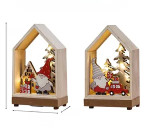 Detail view of wooden Christmas house ornaments with LED lights and gnome designs